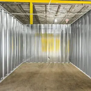 A room with metal walls and yellow accents.